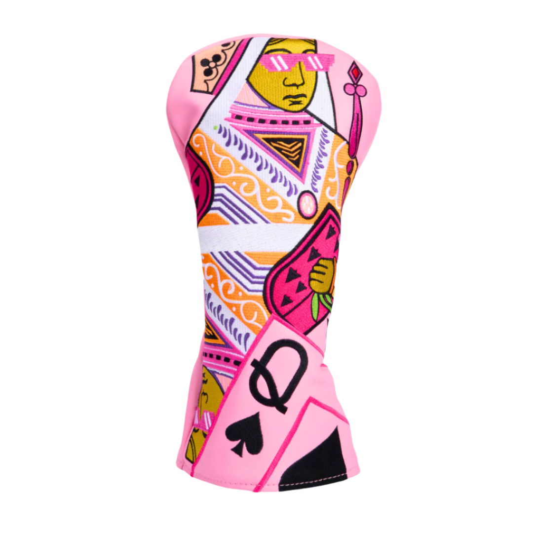 A pink golf club headcover, Golf Queen Headcover from Three Jack Golf, featuring a colorful, geometric pattern with playing card motifs and a prominent queen figure.